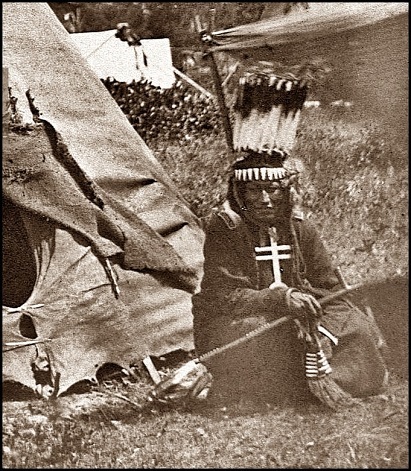 Little Big Mouth a medicine man seated in front of his lodge near Fort Sill Oklahoma. min